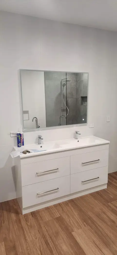 New double basin vanity installed in a renovated bathroom