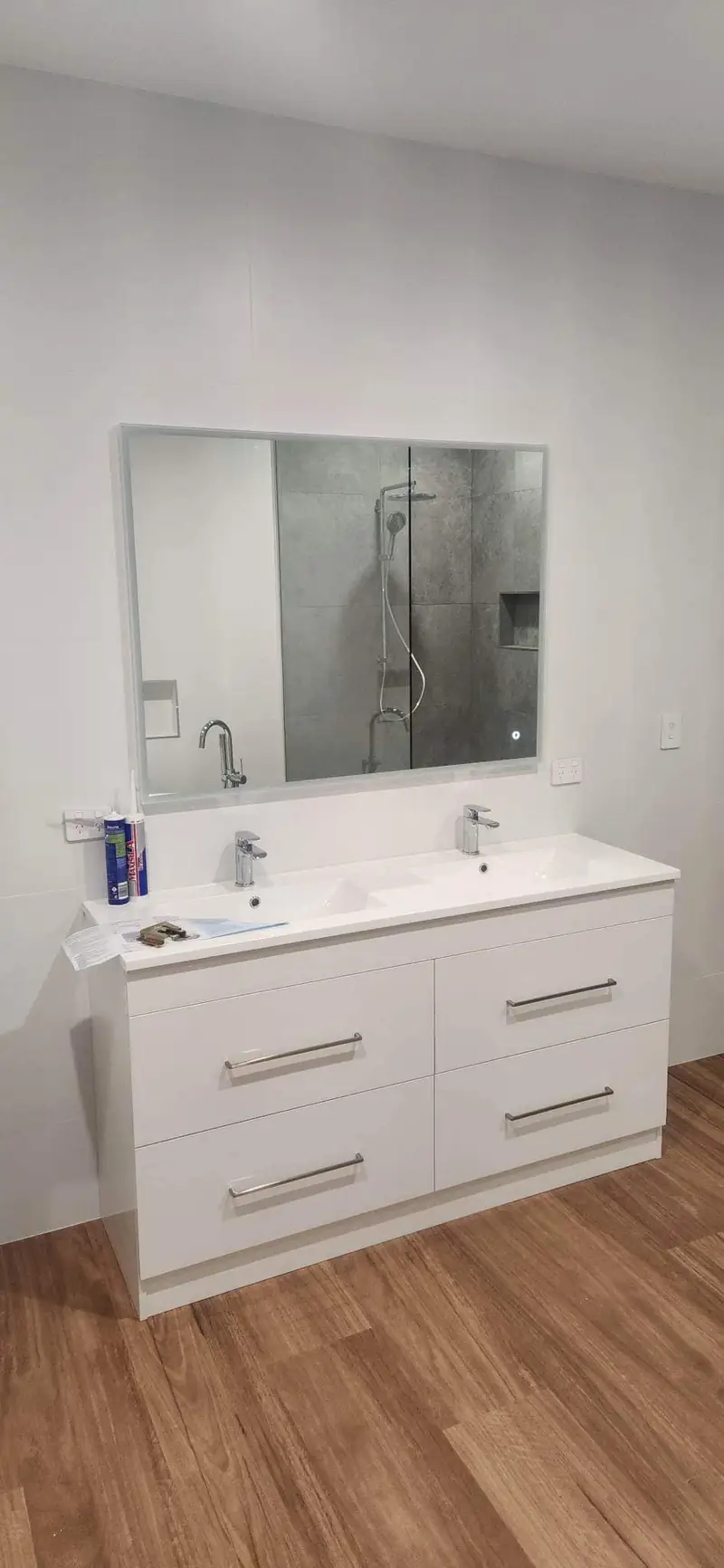 New double basin vanity installed in a renovated bathroom