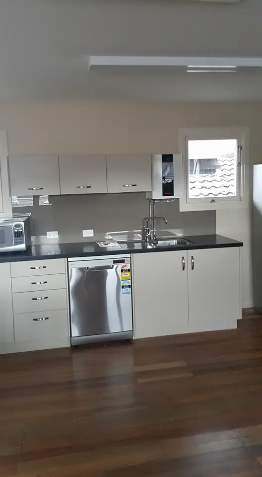 Renovated kitchen with dishwasher and sink plumbed in